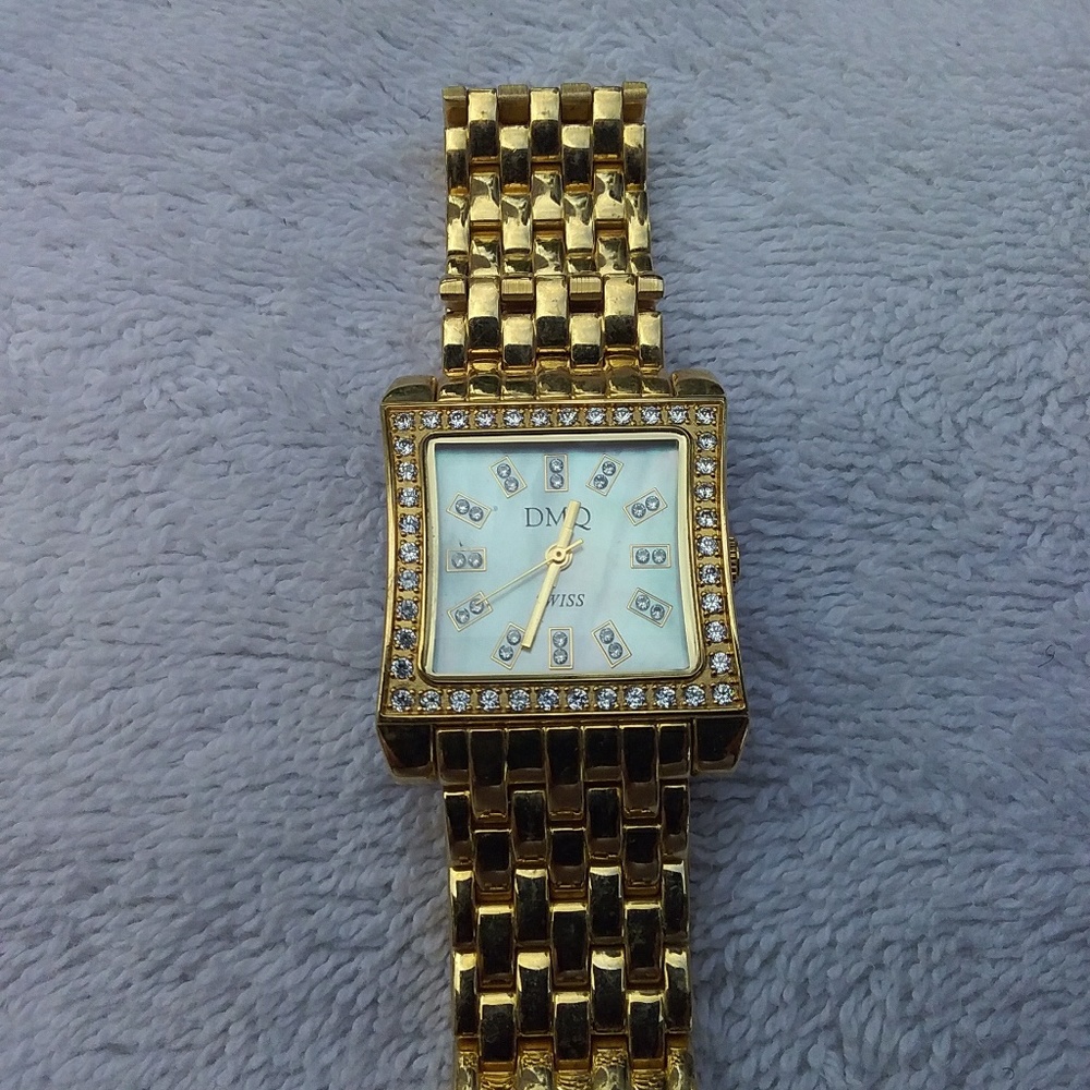 DMQ gold watch